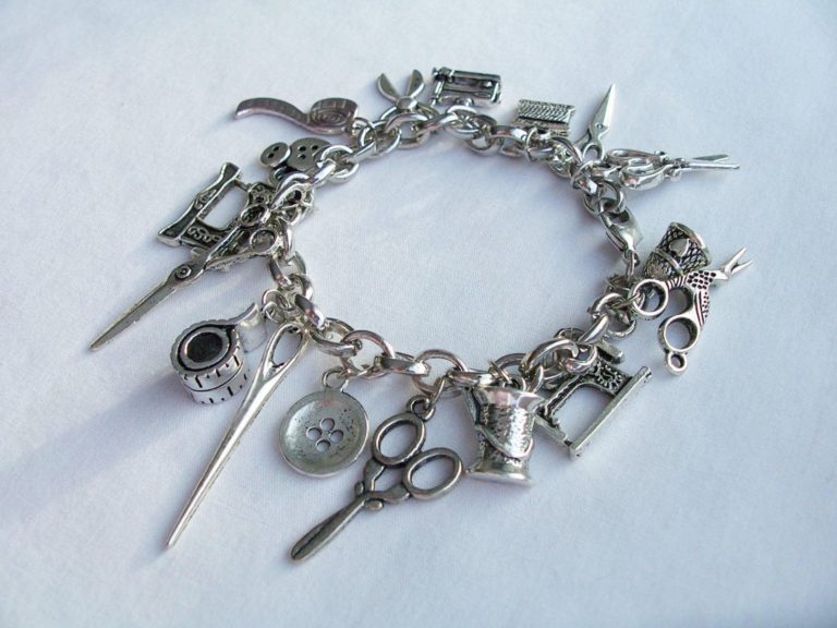 sparkleandcomfort sewing themed charm bracelet from etsy with sewing charms