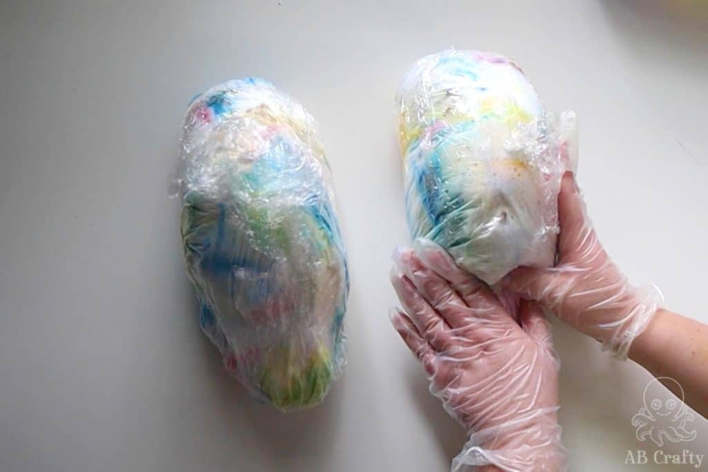 using hands to press the shaving cream and dye around the shoes