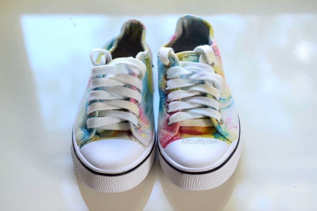 front of the finished tie dye shoes with rainbow pattern and white laces