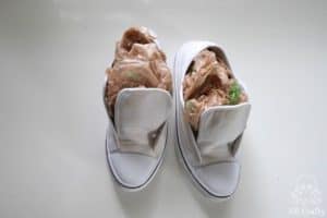 white converse filled with plastic shopping bags
