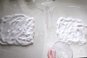 shaping shaving cream mixture into rectangles on plastic