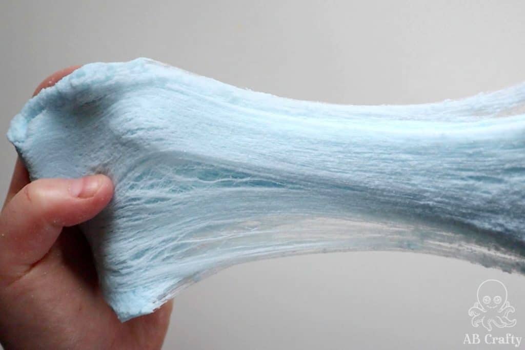 stretching blue snow slime so it shows the strings