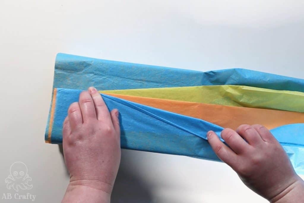 fold the blue tissue paper back at an angle