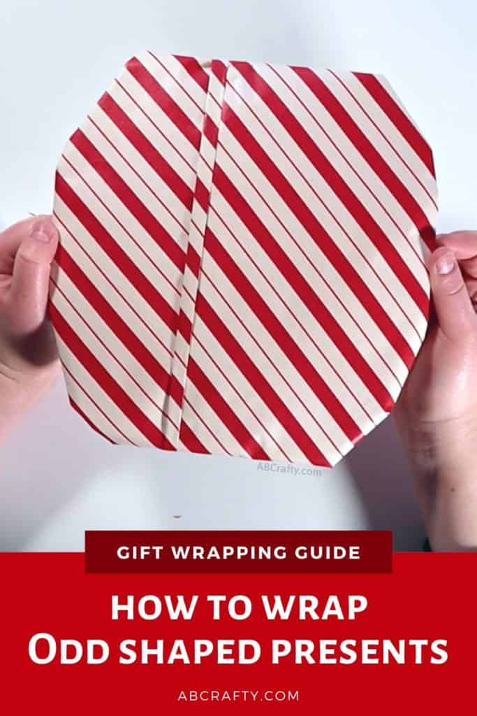 finished gift wrapped frisbee golf disc with red and white striped wrapping paper and a stripe of origami fold and the title reads "gift wrapping guide - how to wrap odd shaped presents"