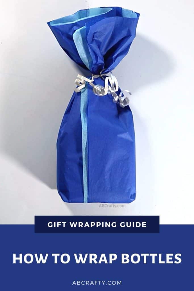 holding the finished present wrapped in blue tissue paper with silver curled ribbon and the title reads "gift wrapping guide - how to wrap bottles"