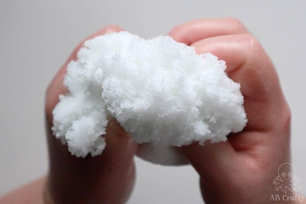holding the snow slime into a snowball shape so it looks fluffy
