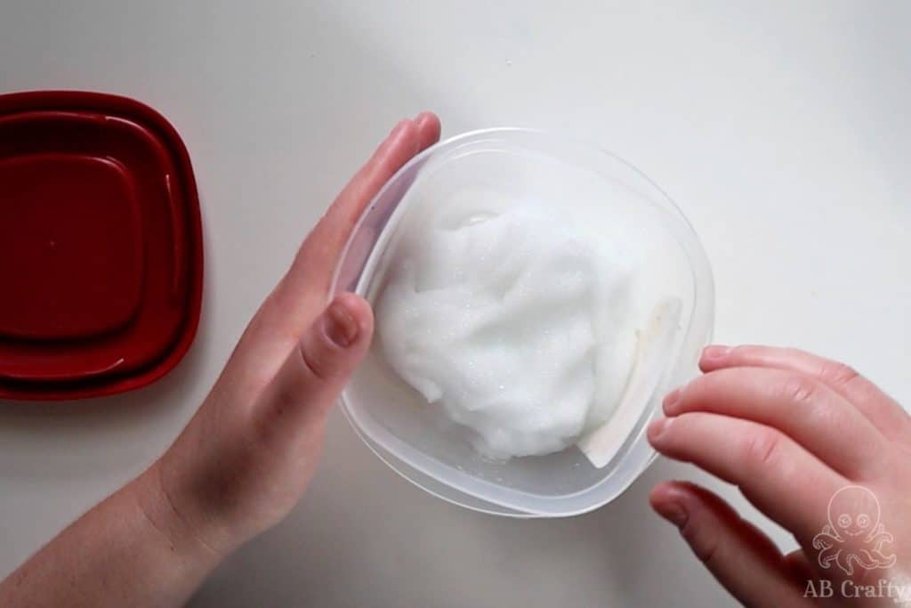 putting the white slime into an airtight container