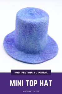 tiny blue wool hat with the title "wet felting tutorial, mini top hat"