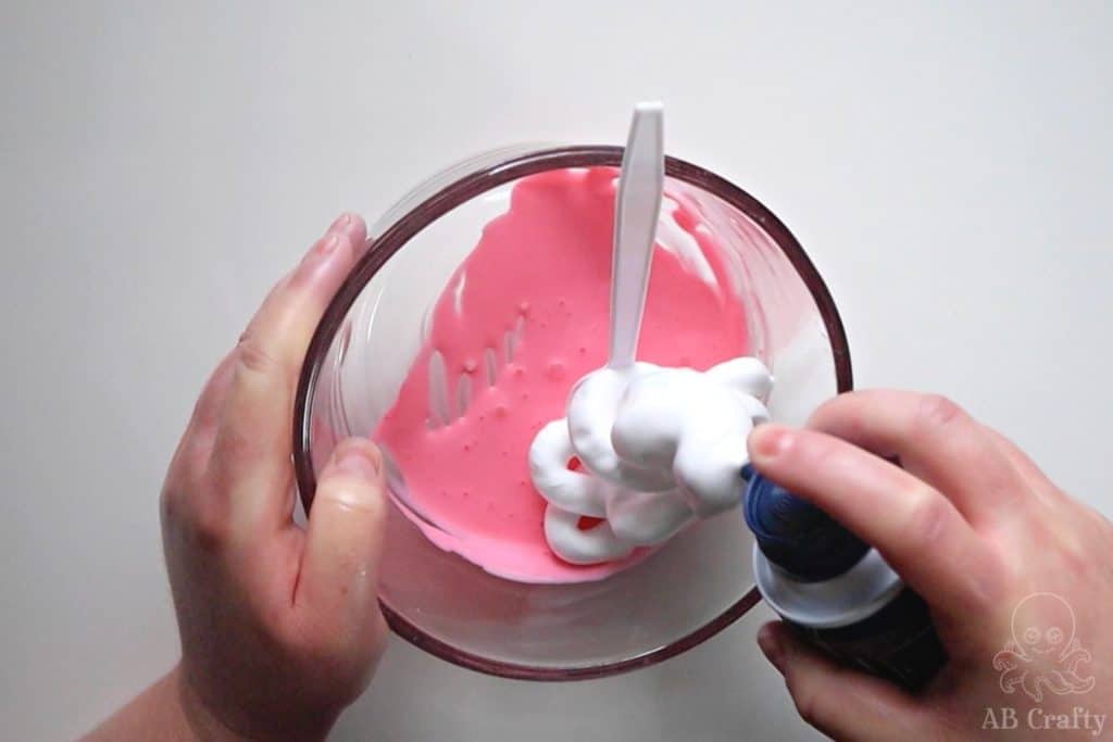 adding shaving cream to glue that has been dyed red