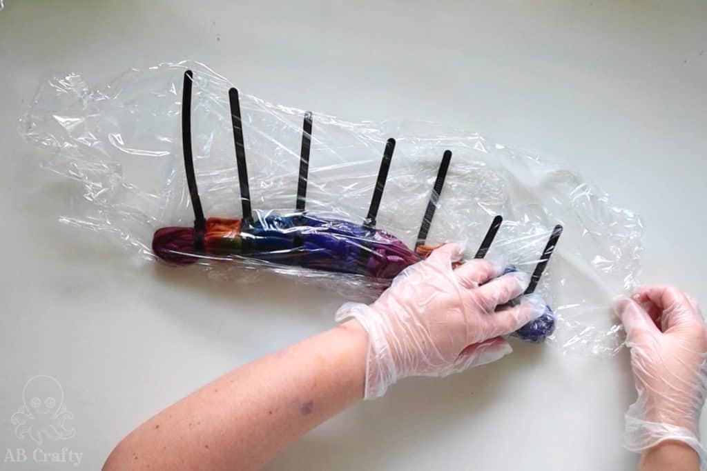 wrapping the dyed tank top in plastic wrap