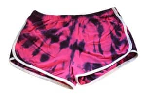 finished pink shorts with black tie dye in the shape of a spiral from the top corner
