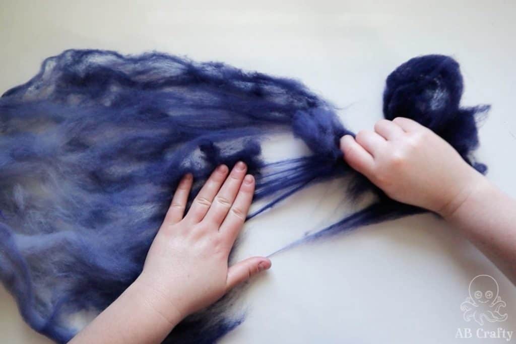 pulling the darkest fibers off of navy wool