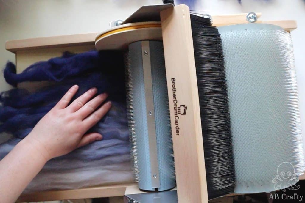 placing navy wool from dark to lightest into a brother drum carder