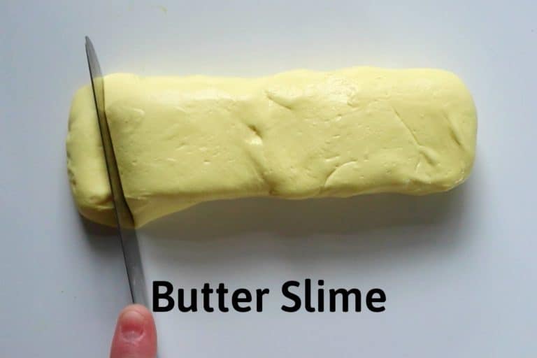 using a knife to cut a pad of "butter" off the end of the butter slime shaped into a stick of butter and the title reads "butter slime"