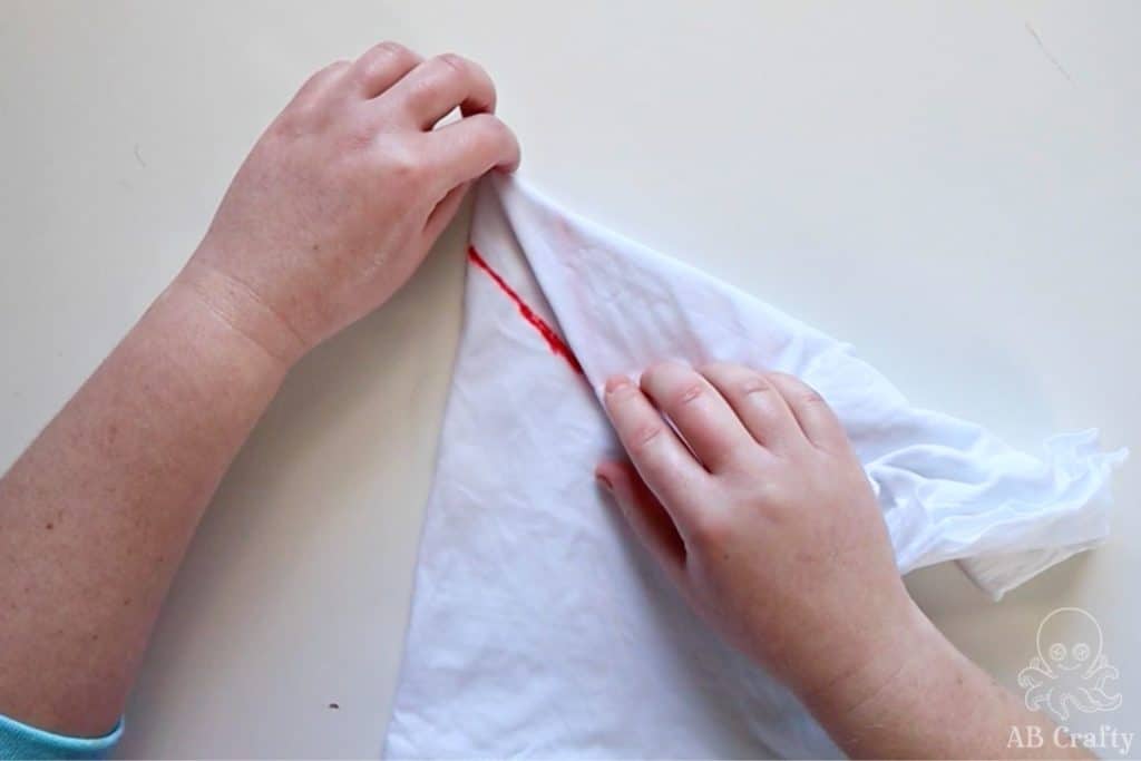 folding the corner of a white shirt