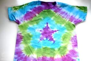 finished shirt with a star tie dye design in purple, blue, and green