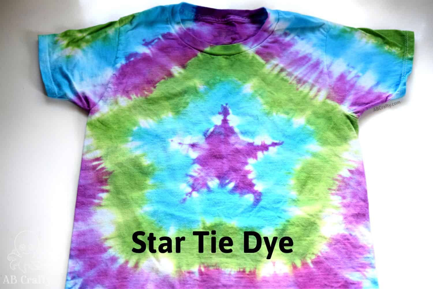 finished shirt with a tie dye star design in purple, blue, and green with the title "star tie dye"