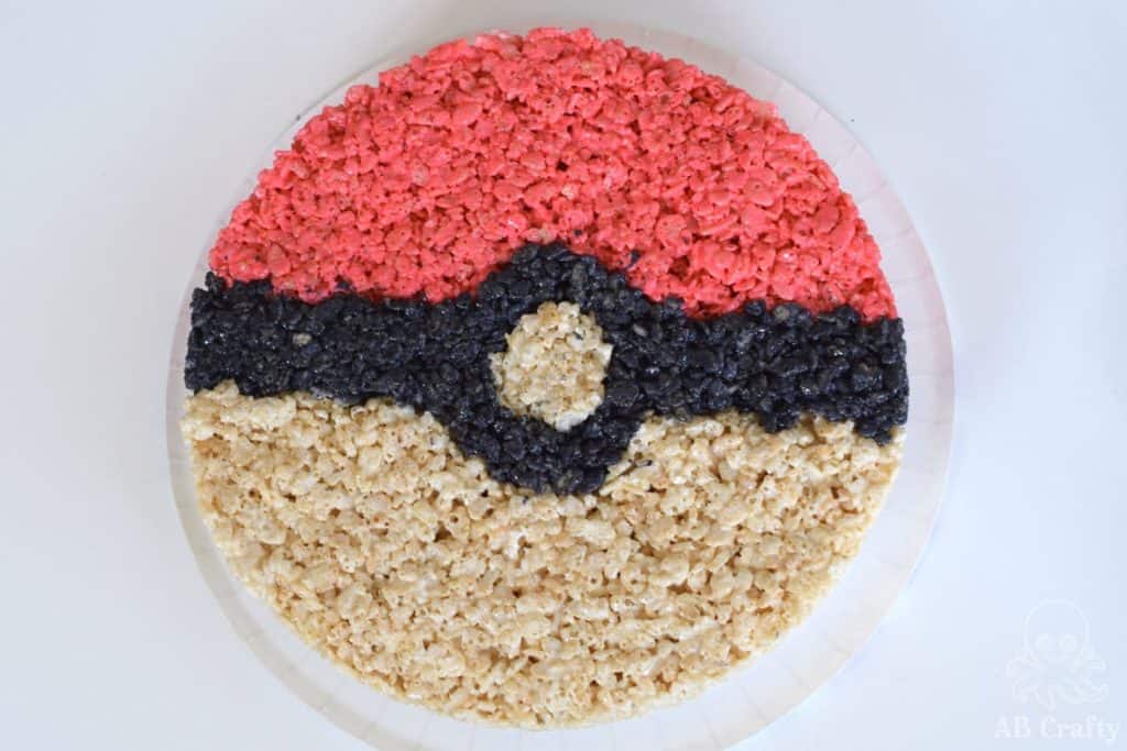 finished giant rice krispie treat in the shape of a pokeball