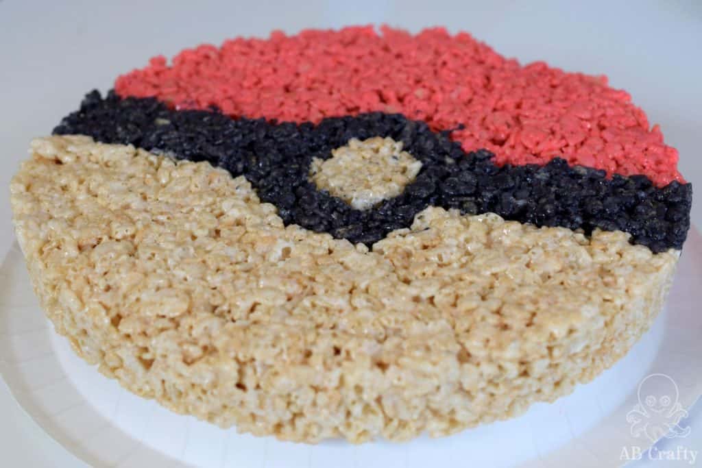 finished giant rice krispie treat in the shape of a pokeball from the side