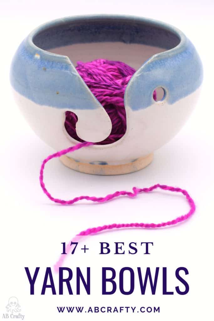 two toned ceramic yarn bowl with a blue stripe with pink yarn inside coming out of it with the title "17+ best yarn bowls, abcrafty.com"