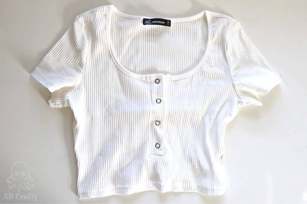 plain white cotton crop top on a table