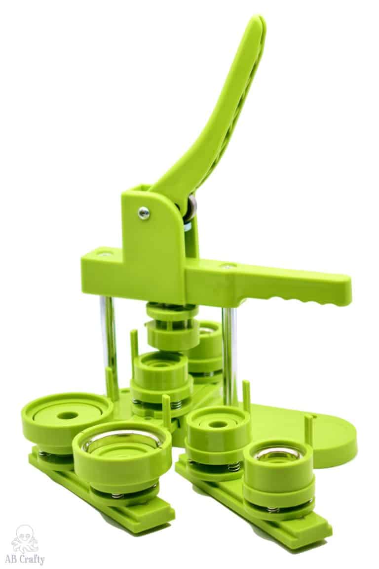 green multiple size button maker with inserts to make multiple size buttons