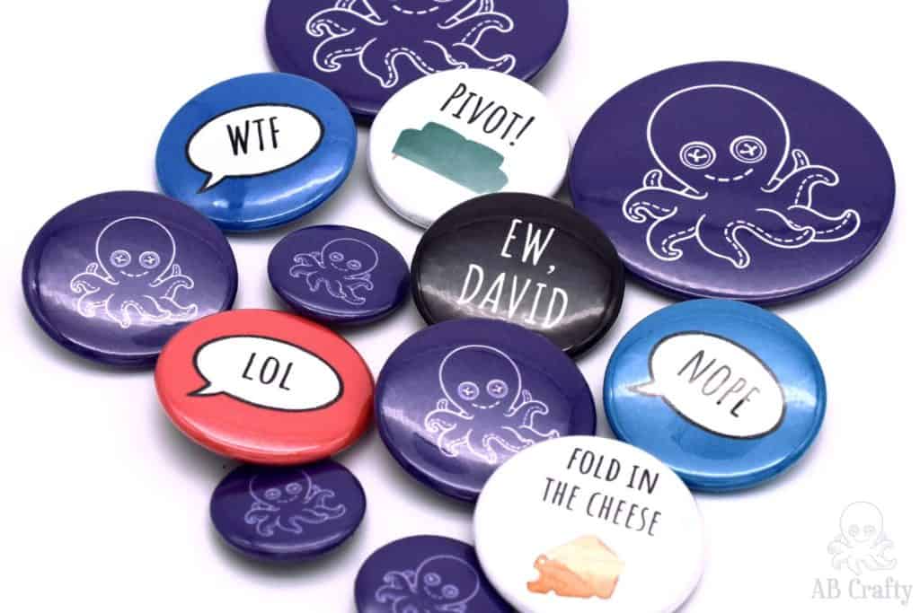 finished buttons of different sizes with the different sayings