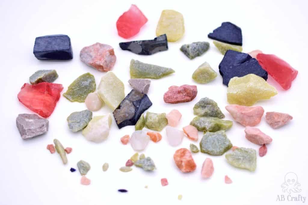 various raw stones from a rock tumbling kit