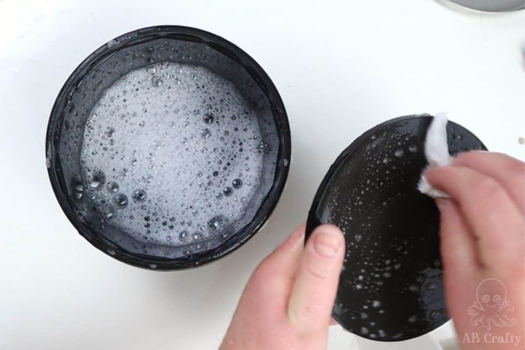 washing the barrel and lid with soap