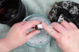 using a toothbrush to clean the stones