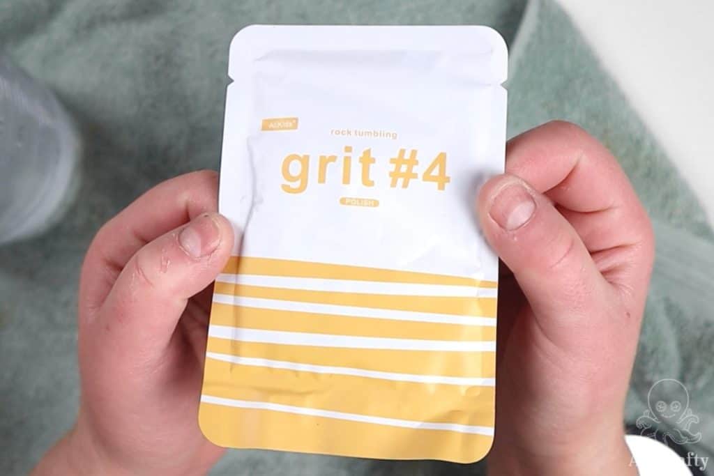 holding a pack of grit 4 polish