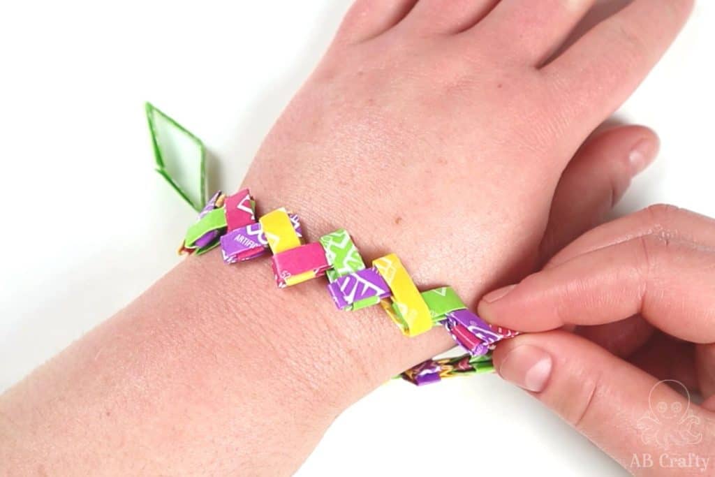 wrapping the candy wrapper chain around the wrist to test the length