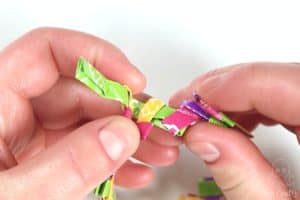 tucking the wrapper into the other end of the chain