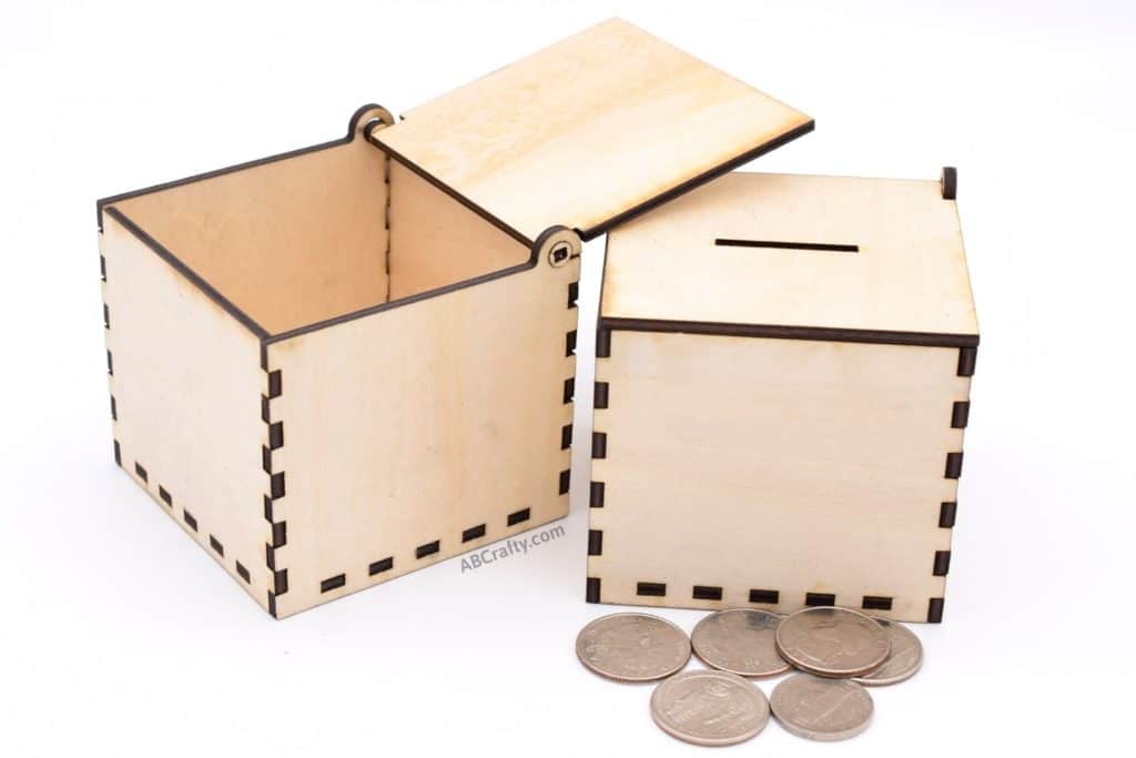 open laser cut box and laser cut coin box with coins in front