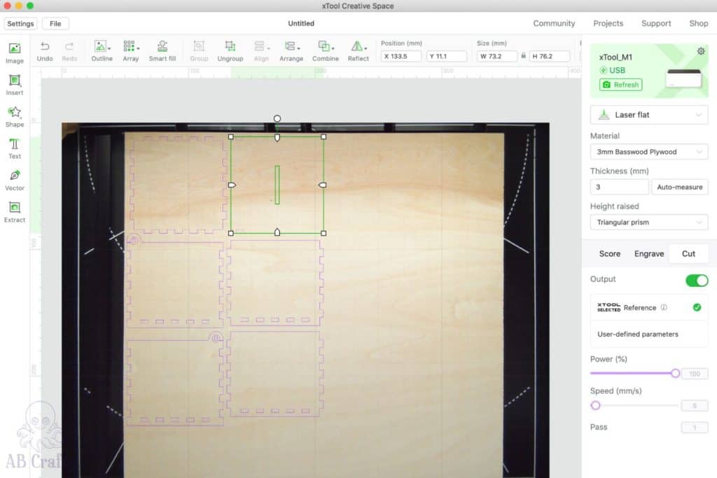 xtool creative space UI showing laser cut box template over the image of the plywood