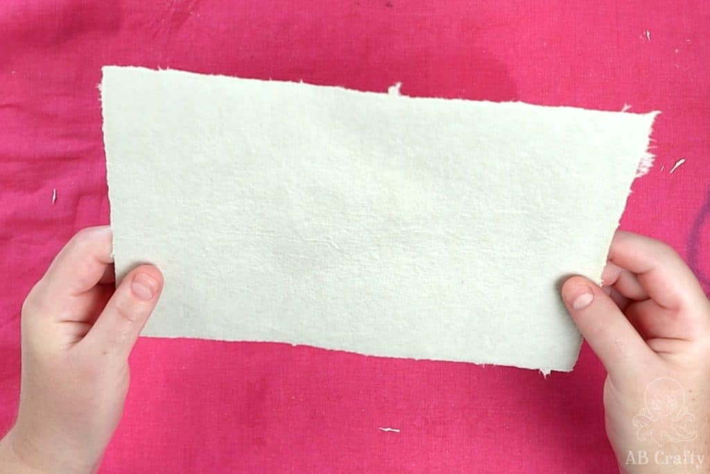 holding the finished homemade paper