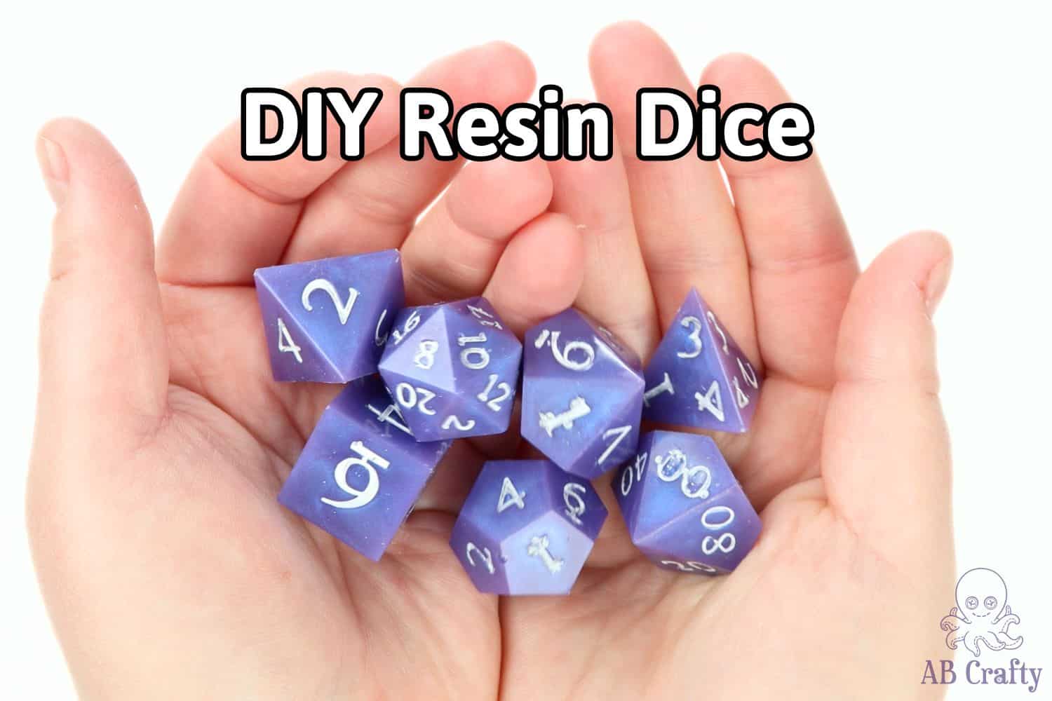holding a set of purple resin dice with white numbers and the title "diy resin dice"